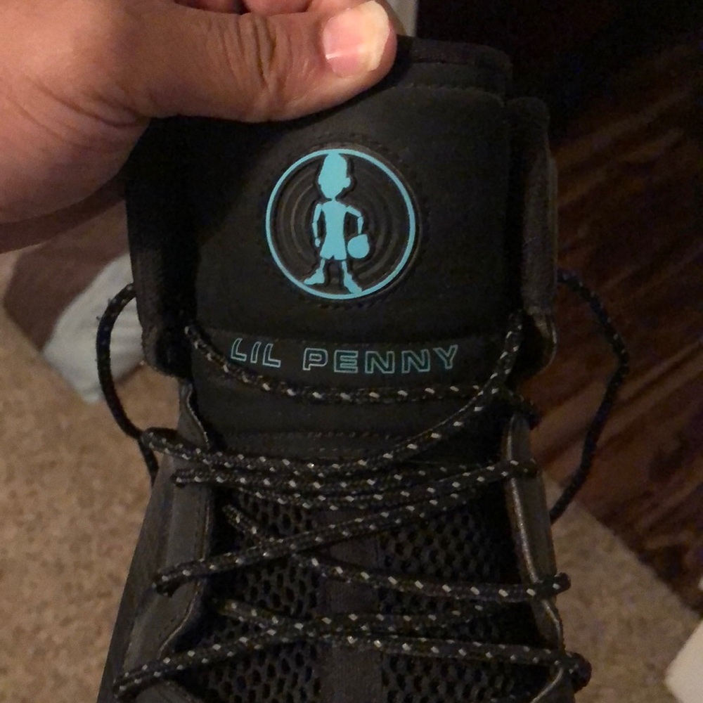 Lil penny posite black and teal size 10